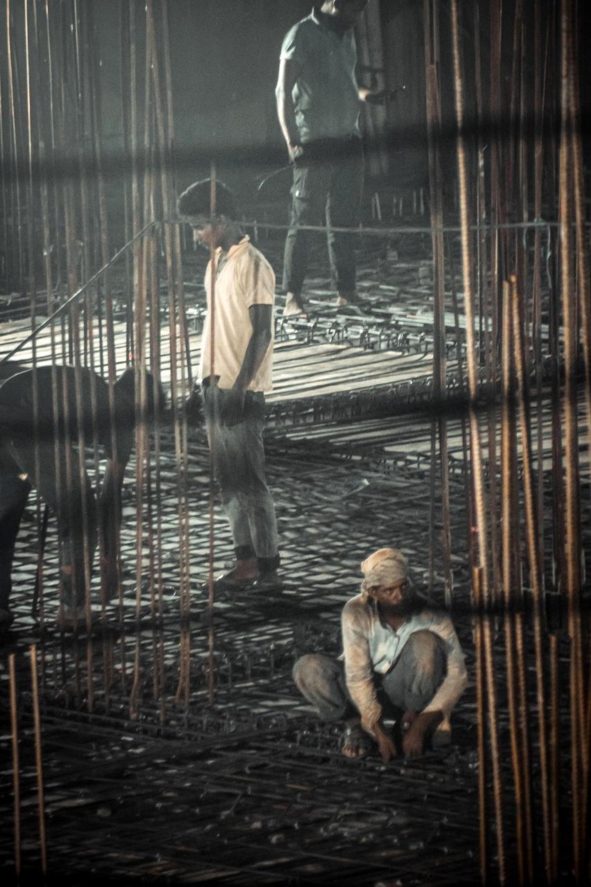 Engineer reviewing blueprints